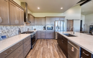 Modern kitchen in Show Low, AZ, with wood flooring, ample cabinetry, and a warm, inviting feel.