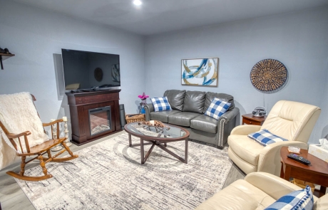 Cozy living room, carpeted floor, modern feel, TV wall unit storage, for sale in Show Low, Arizona.