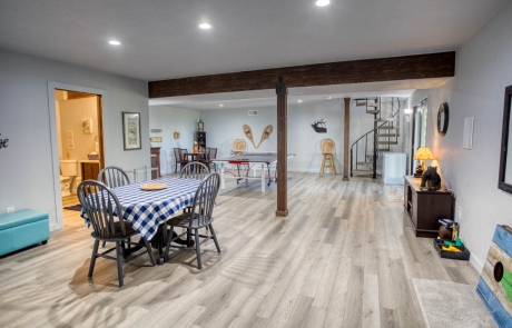 Spacious recreational room with wood flooring, open storage, cozy ambiance, for sale in Show Low, Arizona.